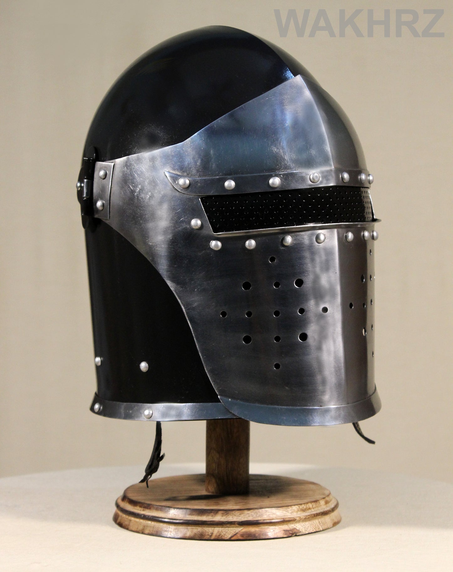 WAKHRZ BURBUTA VISORED CRUSADER HELMET WITH WOODEN BASE.