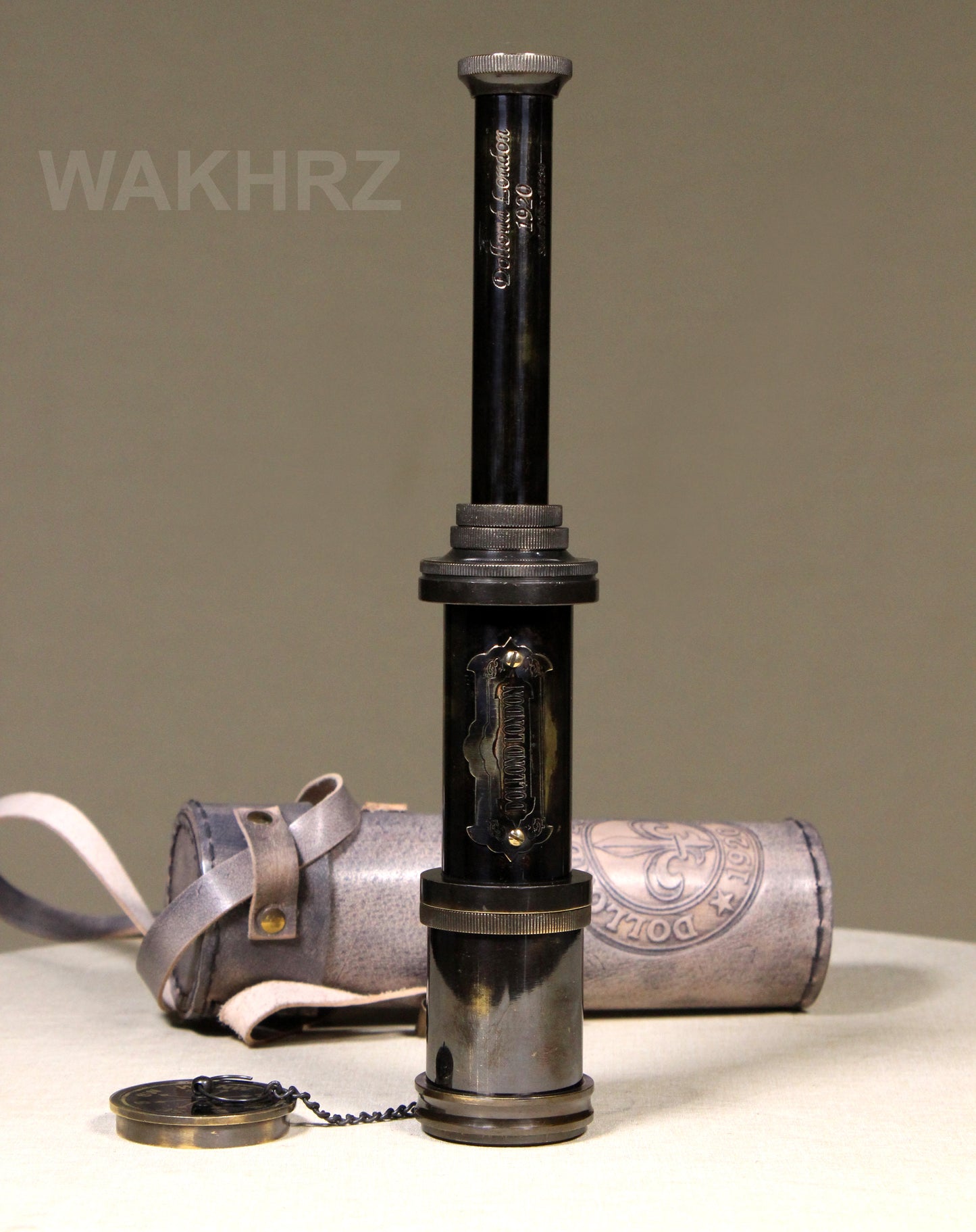 WAKHRZ SHINY BLACK BRASS DOLLOND LONDON TELESCOPE WITH SIDE LEATHER BOX.
