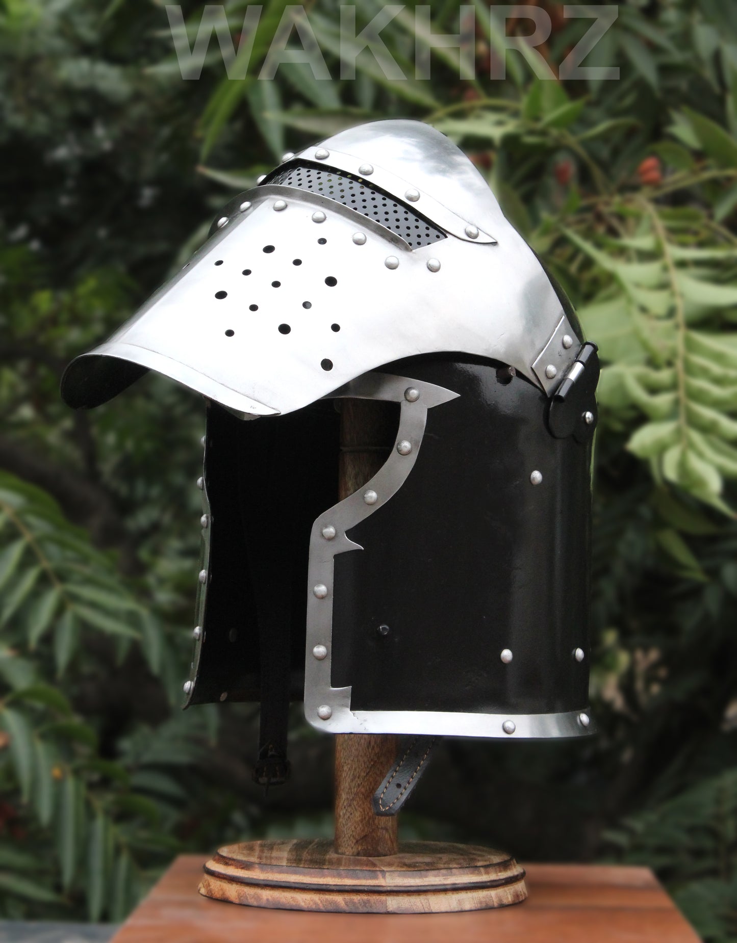 WAKHRZ BURBUTA VISORED CRUSADER HELMET WITH WOODEN BASE.
