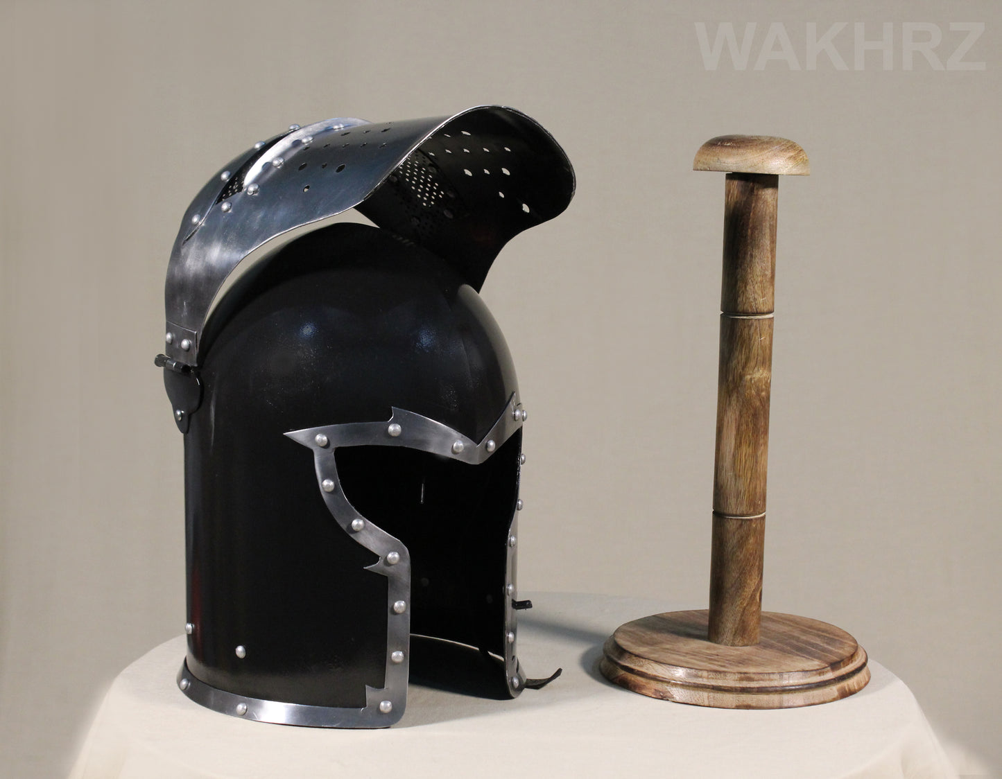 WAKHRZ BURBUTA VISORED CRUSADER HELMET WITH WOODEN BASE.
