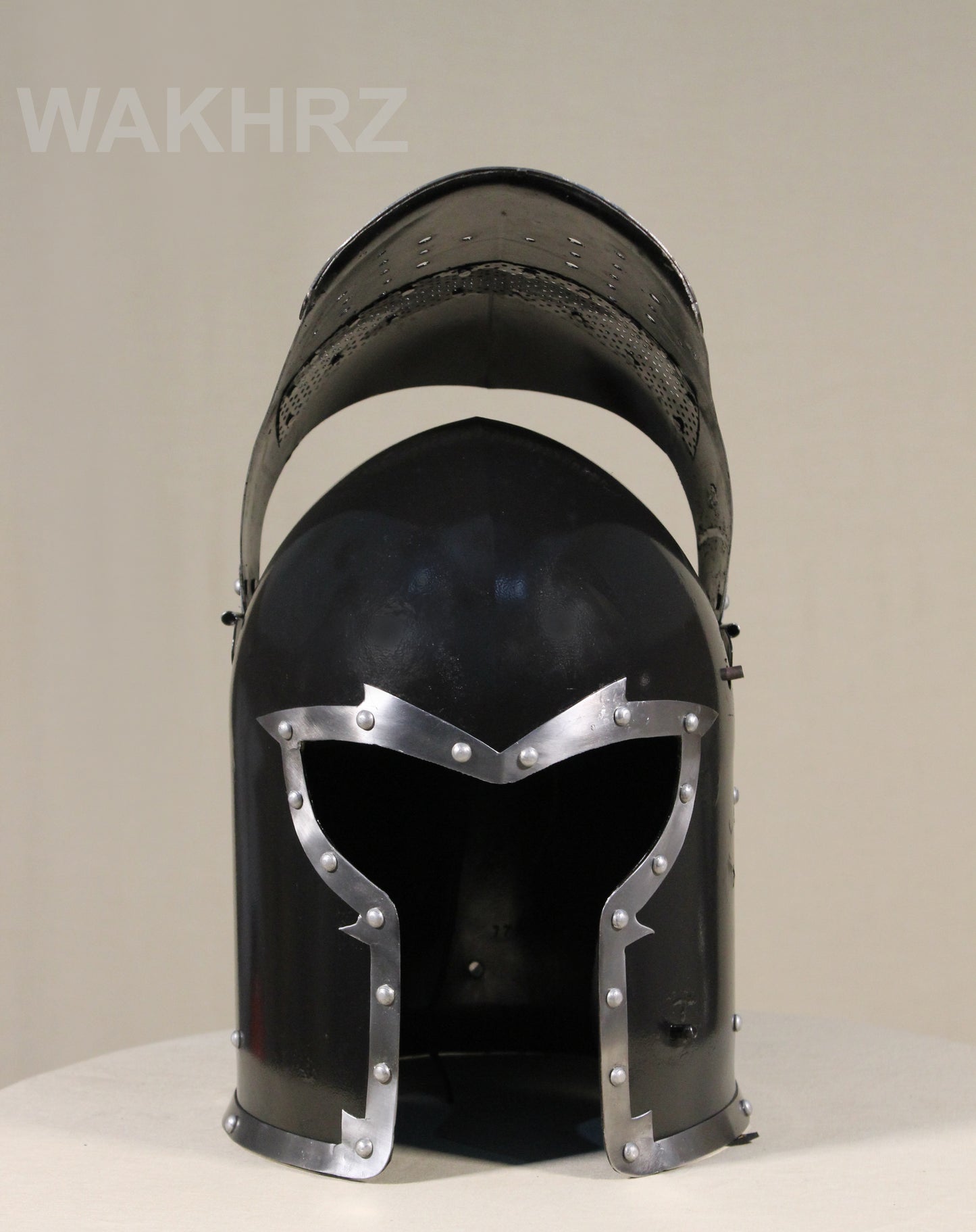 WAKHRZ BURBUTA VISORED CRUSADER HELMET WITH WOODEN BASE.