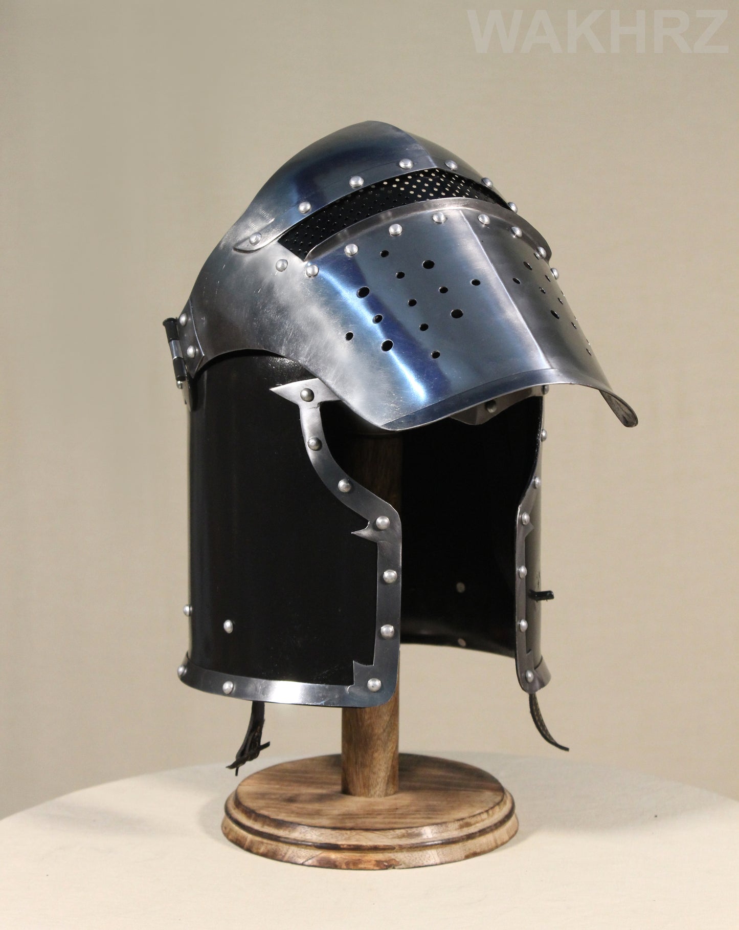 WAKHRZ BURBUTA VISORED CRUSADER HELMET WITH WOODEN BASE.