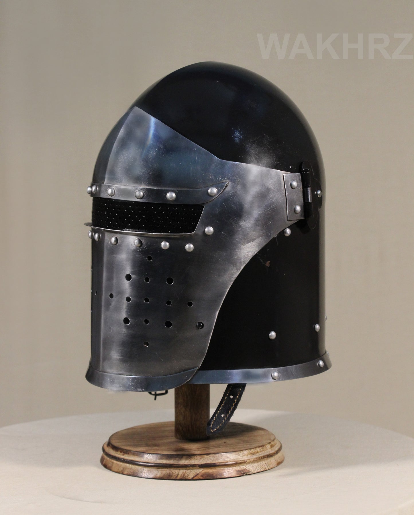 WAKHRZ BURBUTA VISORED CRUSADER HELMET WITH WOODEN BASE.