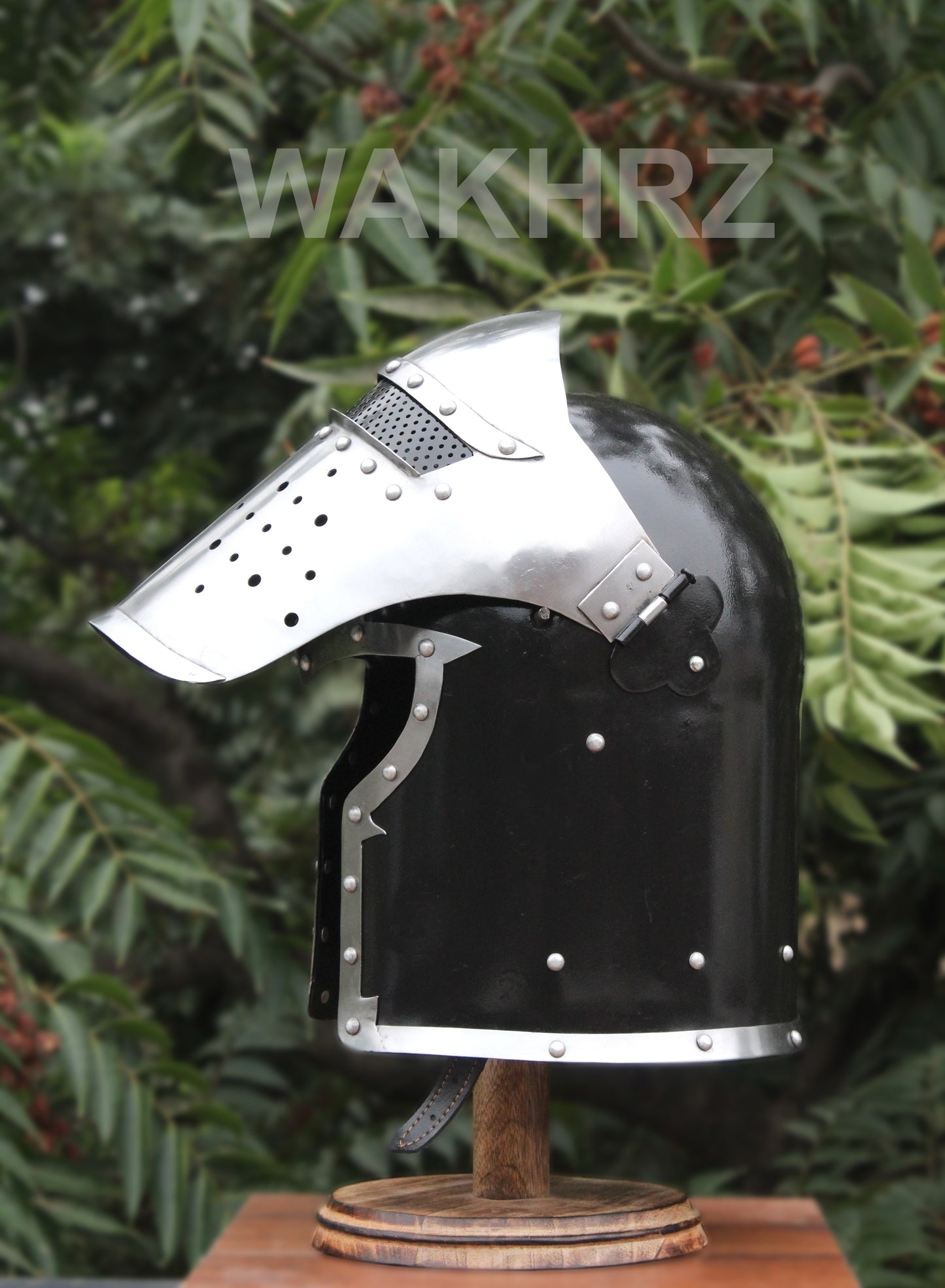 WAKHRZ BURBUTA VISORED CRUSADER HELMET WITH WOODEN BASE.
