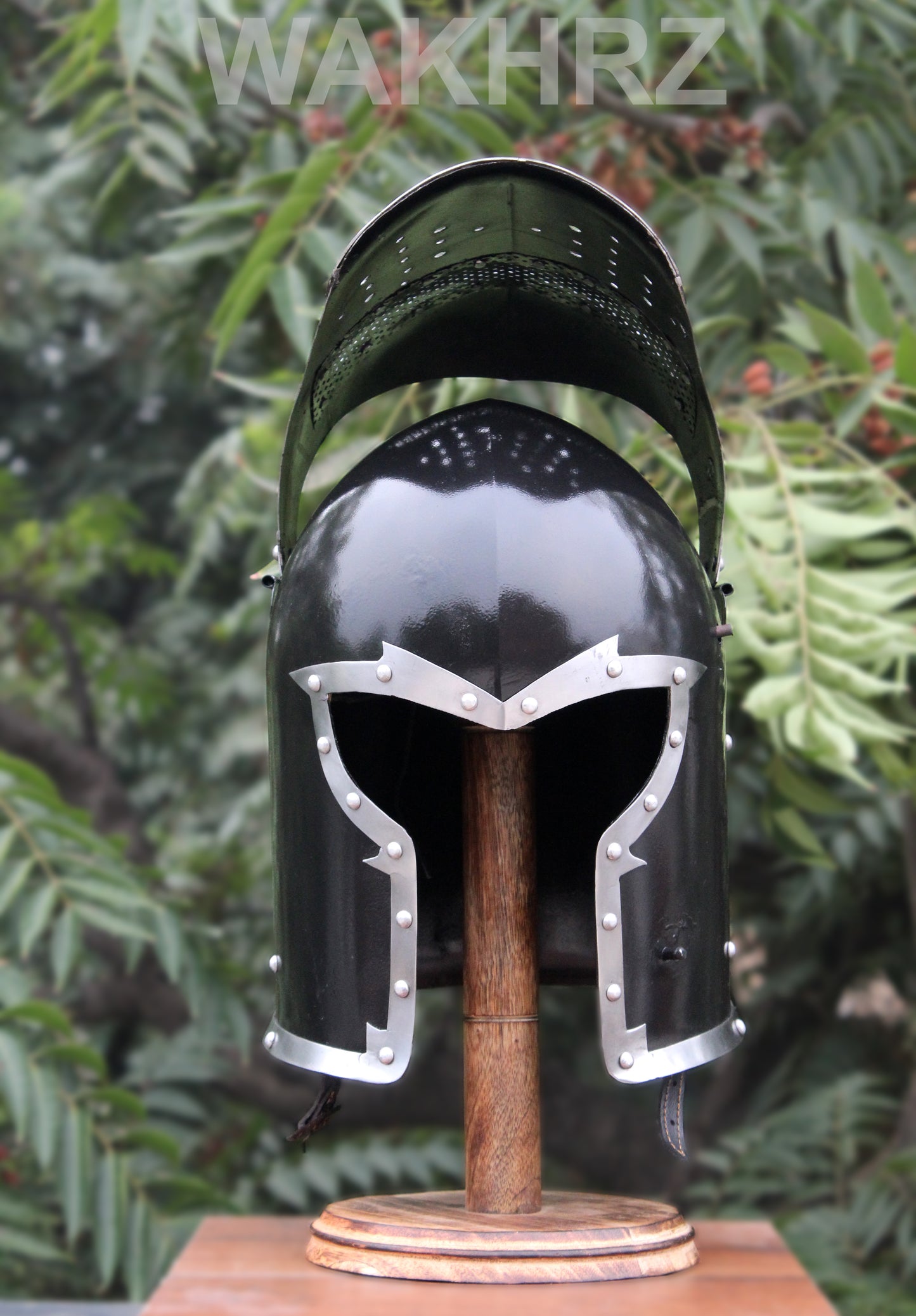 WAKHRZ BURBUTA VISORED CRUSADER HELMET WITH WOODEN BASE.