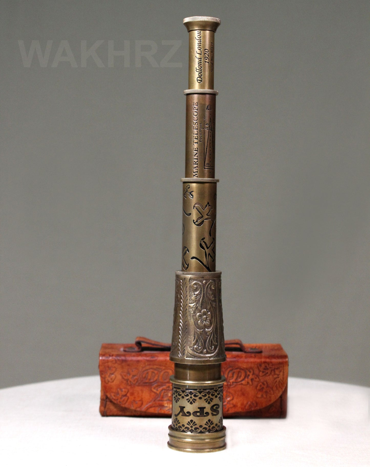 WAKHRZ BRASS MARINE TELESCOPE WITH LEATHER BOX.