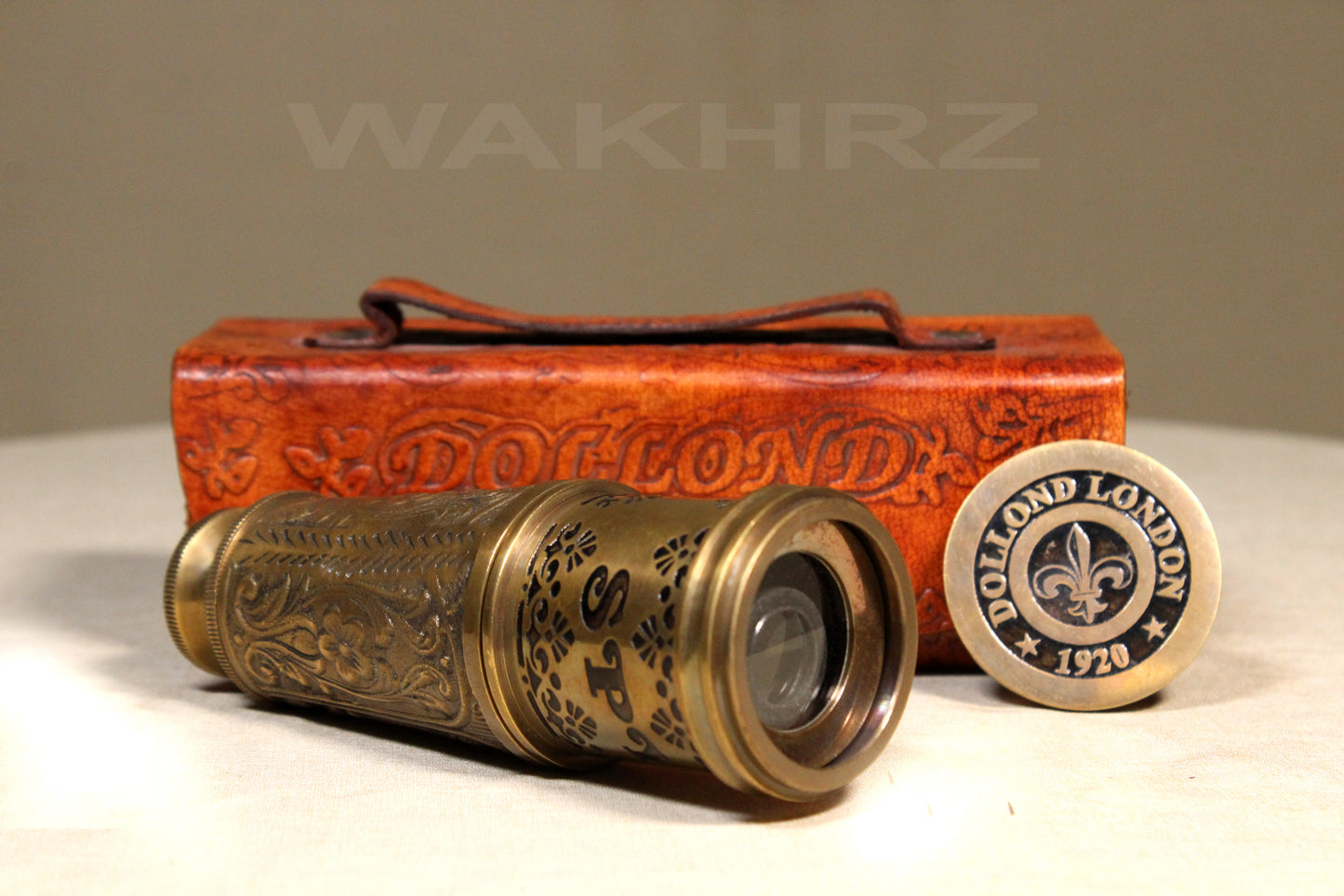 WAKHRZ BRASS MARINE TELESCOPE WITH LEATHER BOX.