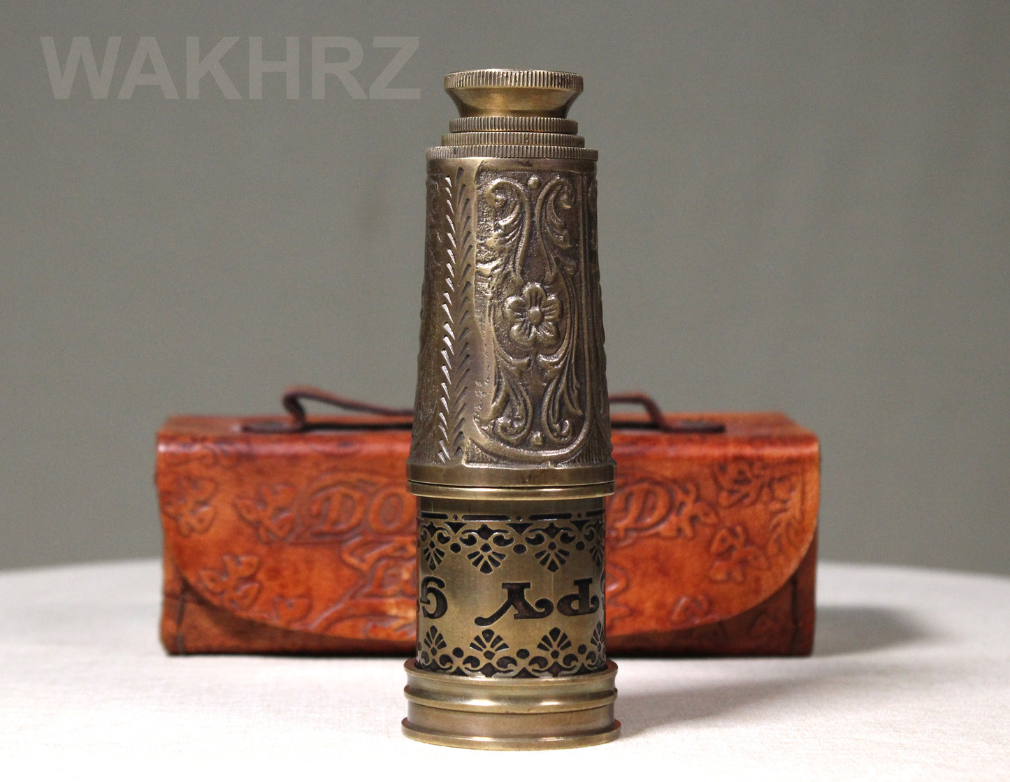 WAKHRZ BRASS MARINE TELESCOPE WITH LEATHER BOX.
