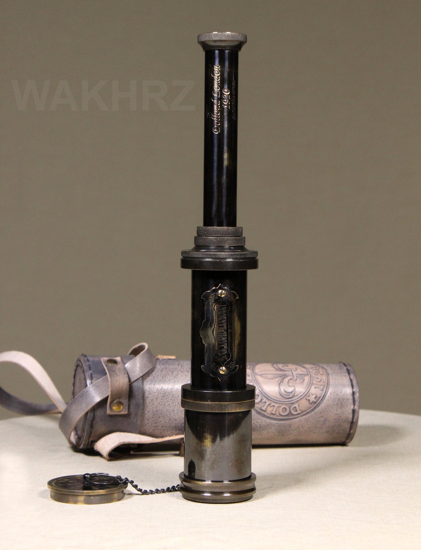 WAKHRZ SHINY BLACK BRASS DOLLOND LONDON TELESCOPE WITH SIDE LEATHER BOX.