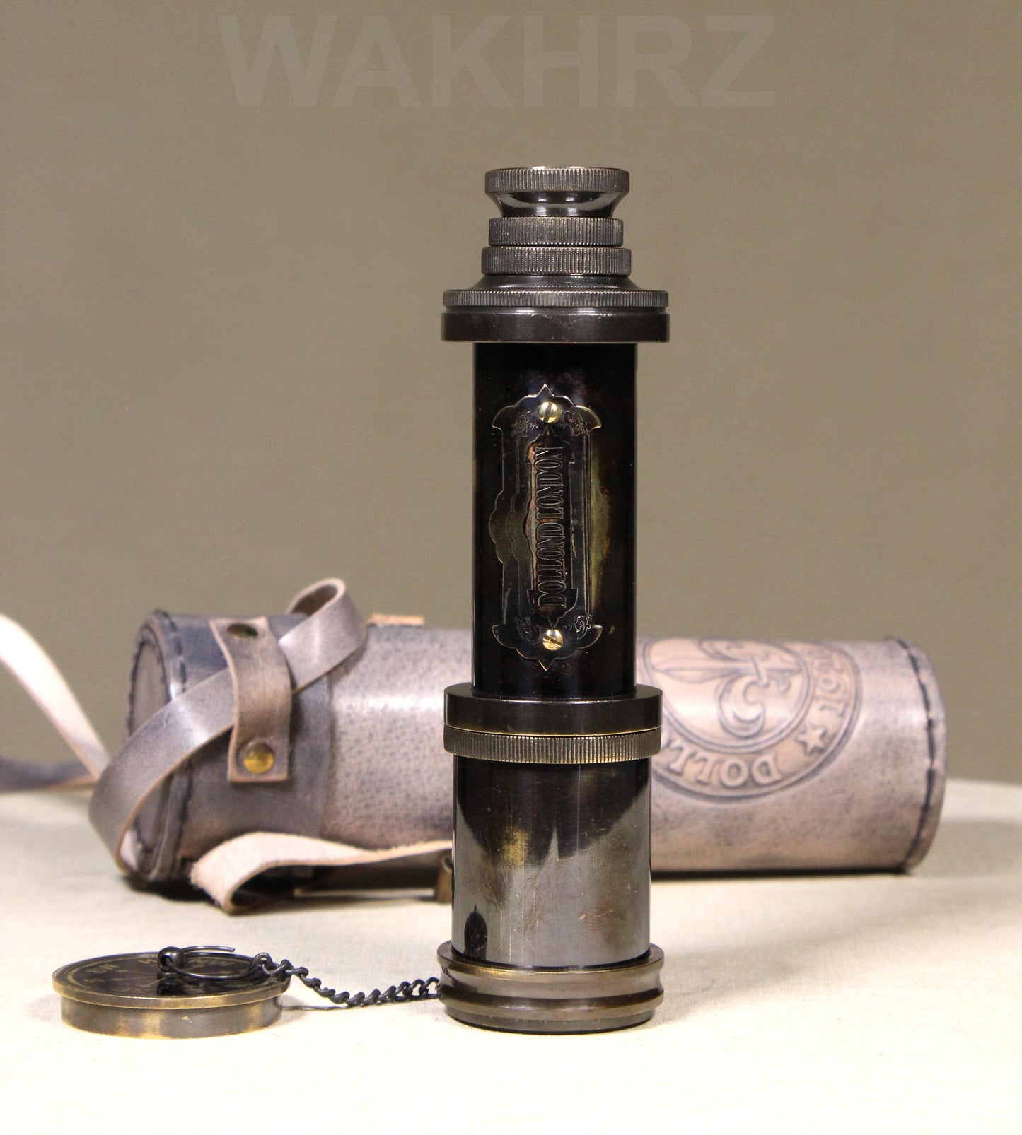 WAKHRZ SHINY BLACK BRASS DOLLOND LONDON TELESCOPE WITH SIDE LEATHER BOX.