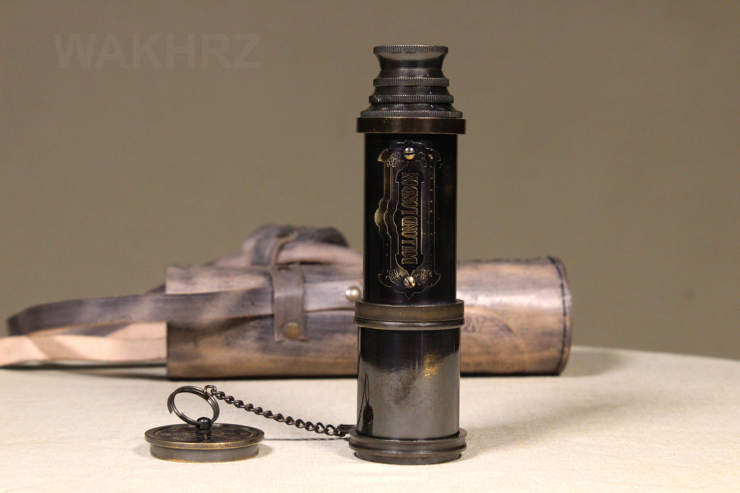 WAKHRZ SHINY BLACK BRASS DOLLOND LONDON TELESCOPE WITH SIDE LEATHER BOX.