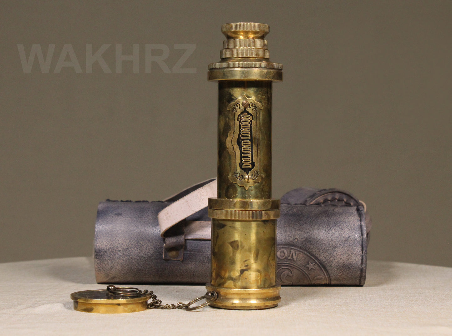 WAKHRZ SHINY BRASS DOLLOND LONDON TELESCOPE WITH SIDE LEATHER BOX.