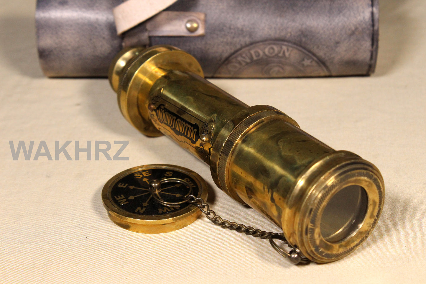 WAKHRZ SHINY BRASS DOLLOND LONDON TELESCOPE WITH SIDE LEATHER BOX.