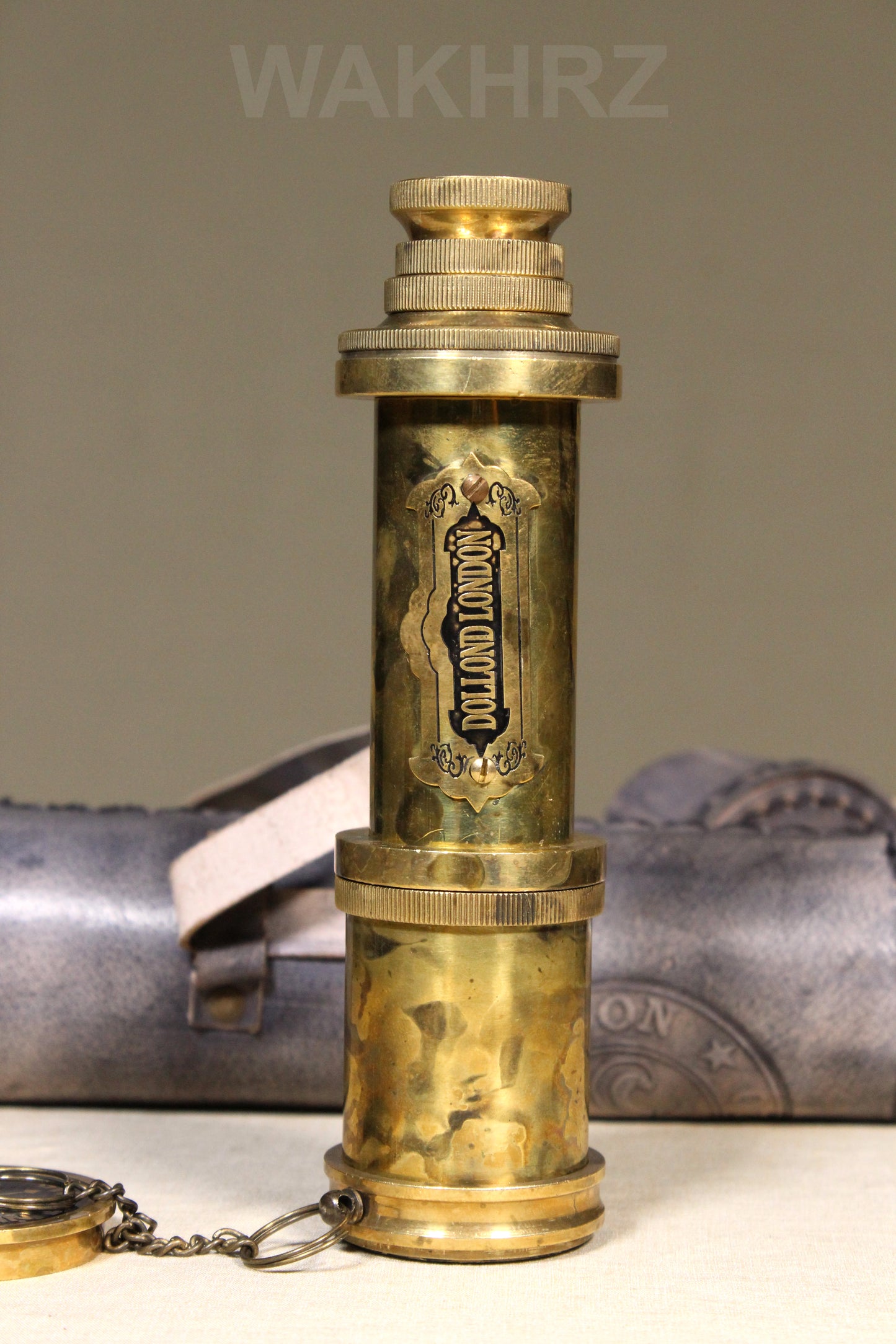 WAKHRZ SHINY BRASS DOLLOND LONDON TELESCOPE WITH SIDE LEATHER BOX.