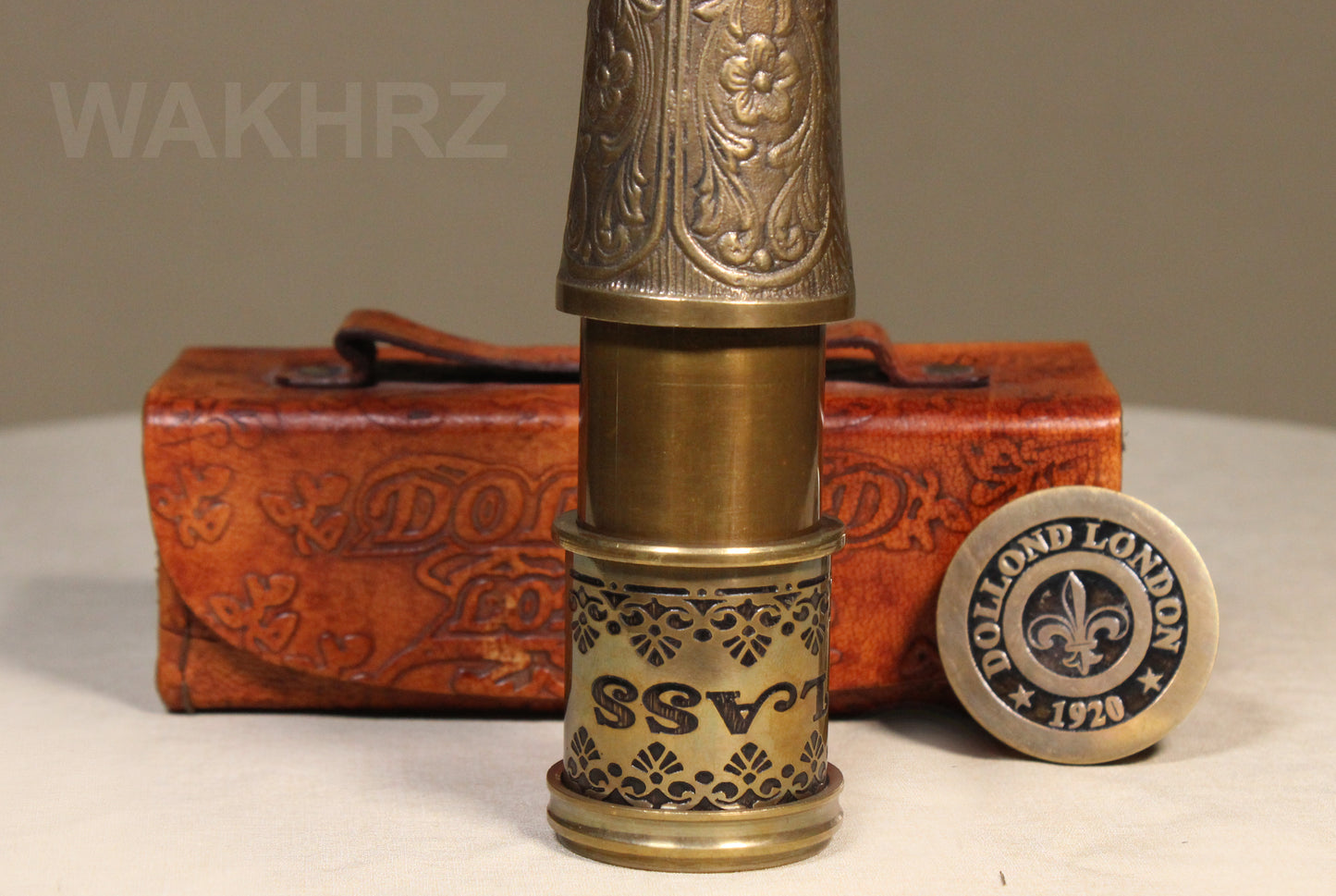 WAKHRZ BRASS MARINE TELESCOPE WITH LEATHER BOX.