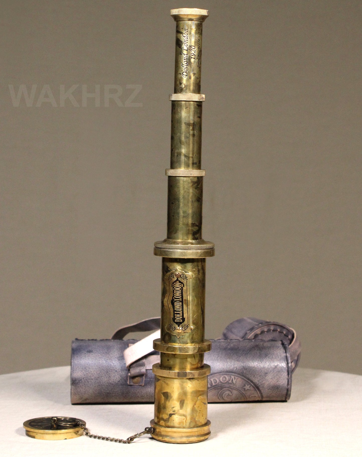 WAKHRZ SHINY BRASS DOLLOND LONDON TELESCOPE WITH SIDE LEATHER BOX.