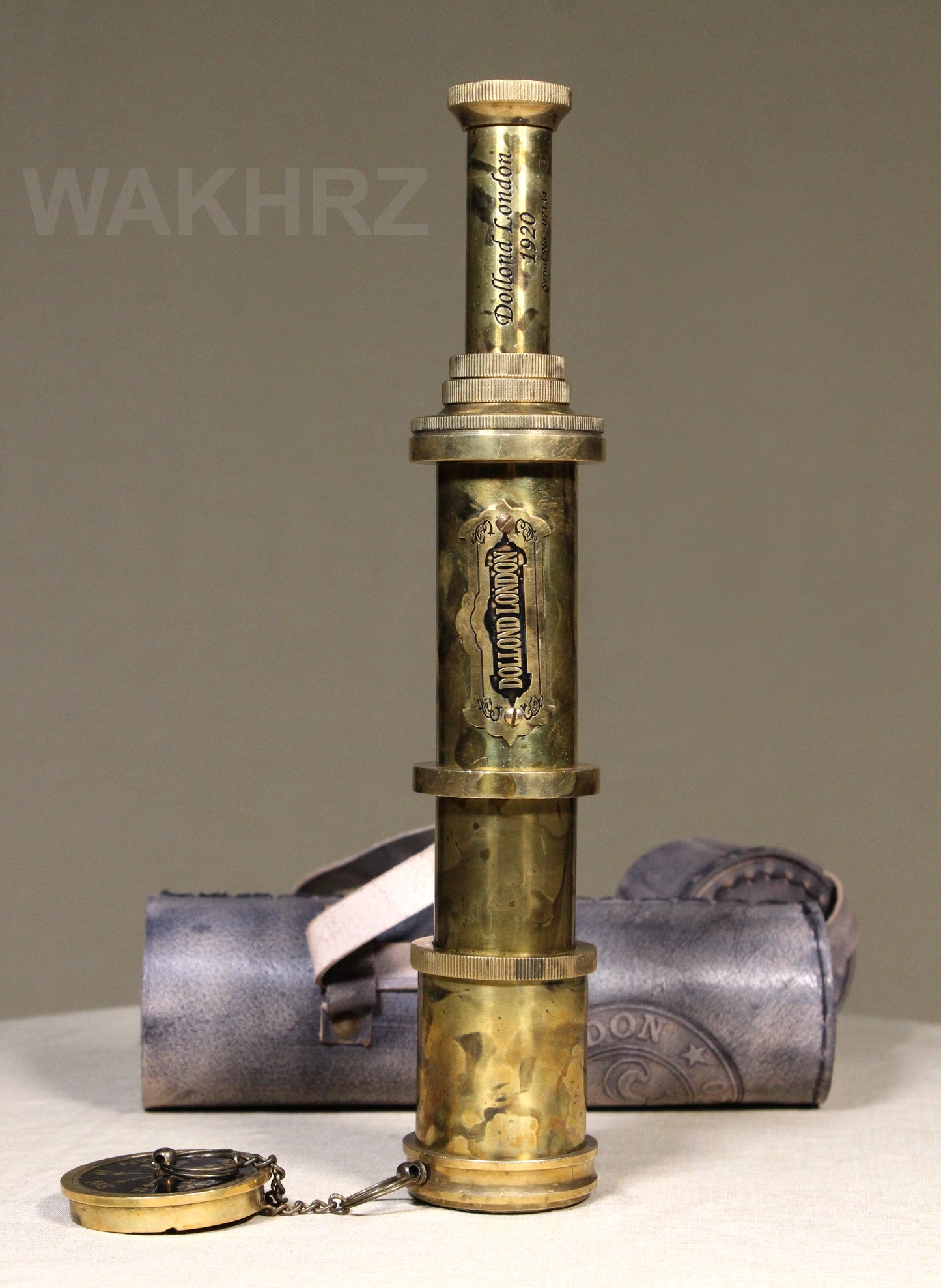 WAKHRZ SHINY BRASS DOLLOND LONDON TELESCOPE WITH SIDE LEATHER BOX.